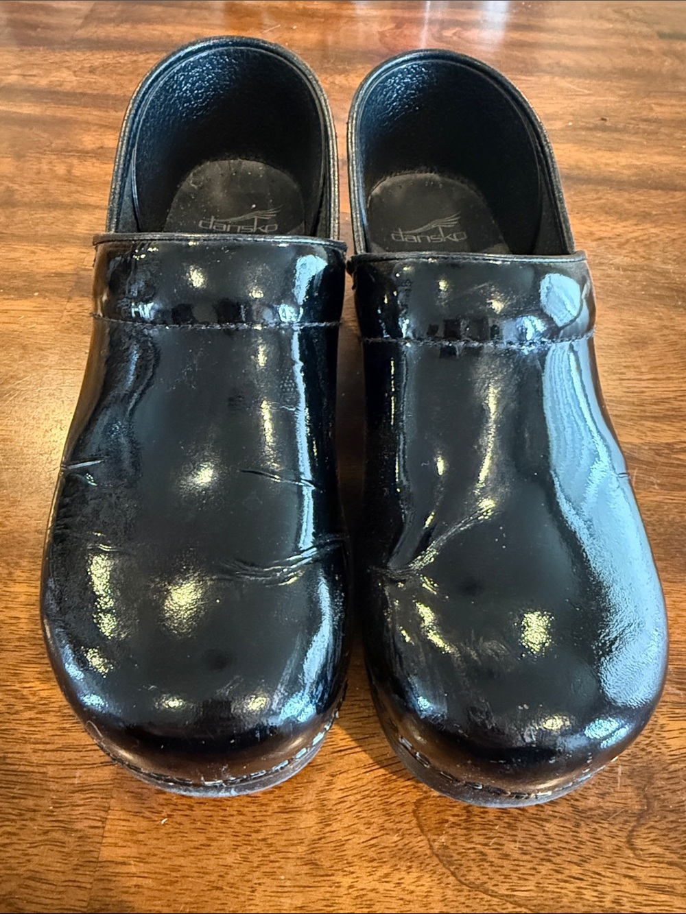 Dansko Black Patent Slip-On Clogs - Glossy Finish